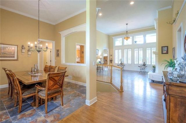 2945 W 143rd Ter, Leawood, KS 66224 - dining space with ornamental molding, baseboards, a chandelier, a high ceiling, and wood finished floors