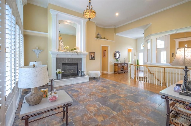 2945 W 143rd Ter, Leawood, KS 66224 - living area with a tiled fireplace, baseboards, ornamental molding, recessed lighting, and stone finish flooring