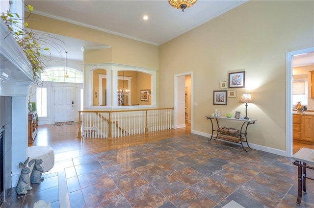2945 W 143rd Ter, Leawood, KS 66224 - entrance foyer with baseboards, ornamental molding, a chandelier, recessed lighting, and a towering ceiling