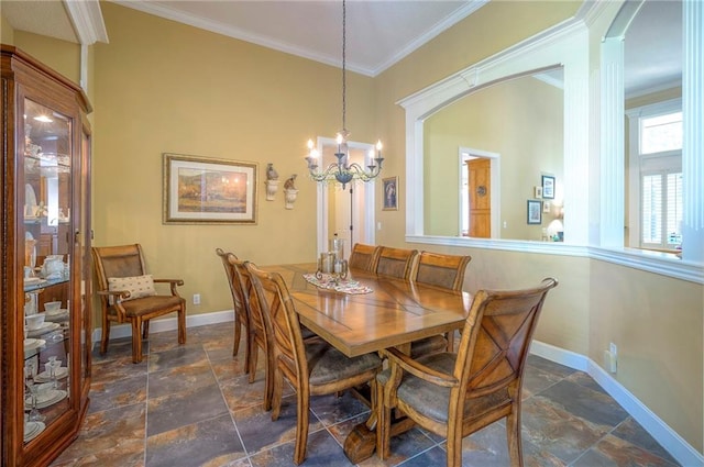 2945 W 143rd Ter, Leawood, KS 66224 - dining room with stone tile flooring, baseboards, crown molding, and a chandelier