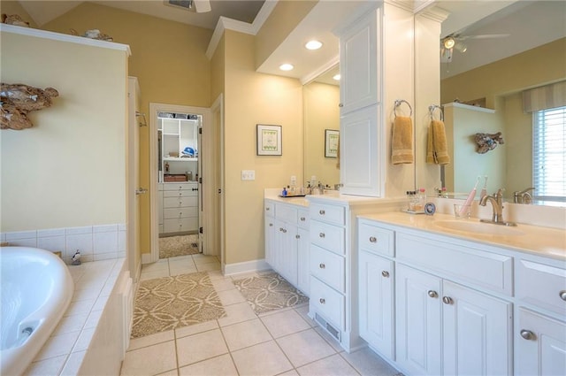 2945 W 143rd Ter, Leawood, KS 66224 - bathroom with double vanity, a garden tub, tile patterned floors, recessed lighting, and crown molding