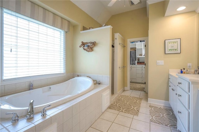 2945 W 143rd Ter, Leawood, KS 66224 - bathroom featuring vanity, a garden tub, ceiling fan, tile patterned floors, and vaulted ceiling
