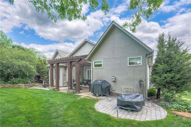 2945 W 143rd Ter, Leawood, KS 66224 - back of house with a patio area, a pergola, a yard, stucco siding, and an outdoor fire pit