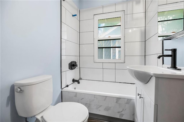 full bath featuring vanity, toilet, and shower / tub combination