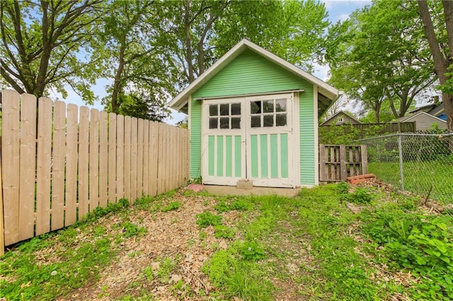 view of shed with a fenced backyard