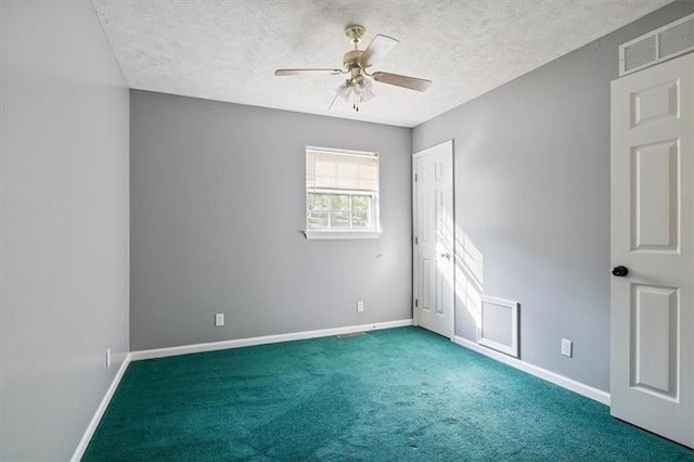 unfurnished room with baseboards, a ceiling fan, and visible vents