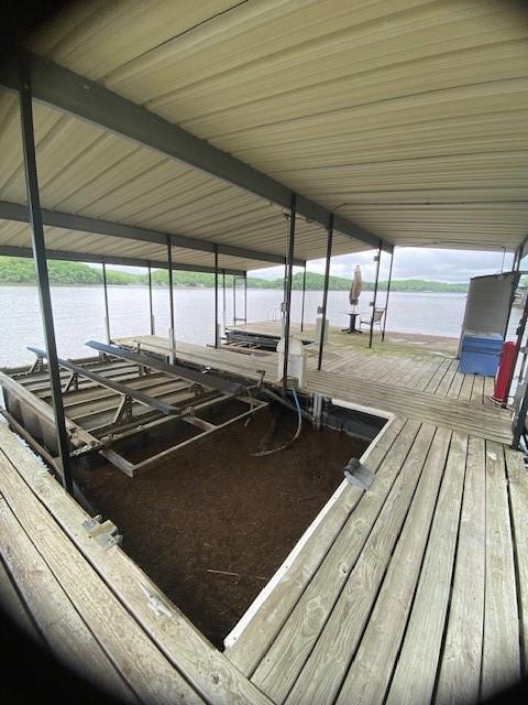 view of dock with a water view and boat lift