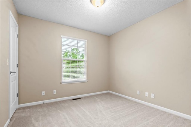 18461 W 157th St, Olathe, KS 66062 - spare room featuring carpet floors and a textured ceiling