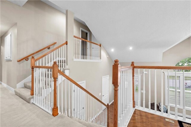 18461 W 157th St, Olathe, KS 66062 - stairs featuring lofted ceiling and recessed lighting