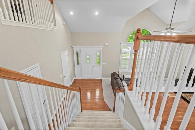 18461 W 157th St, Olathe, KS 66062 - foyer with wood finished floors, high vaulted ceiling, a ceiling fan, stairs, and recessed lighting