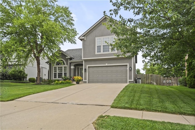 18461 W 157th St, Olathe, KS 66062 - traditional-style home featuring a garage, stucco siding, and driveway