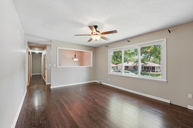 8020 Yecker Ave, Kansas City, KS 66109 - empty room with attic access, a ceiling fan, wood finished floors, baseboards, and a textured ceiling