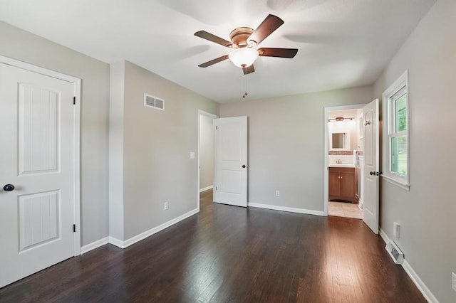 8020 Yecker Ave, Kansas City, KS 66109 - unfurnished bedroom with dark wood finished floors, baseboards, ensuite bathroom, ceiling fan, and a sink