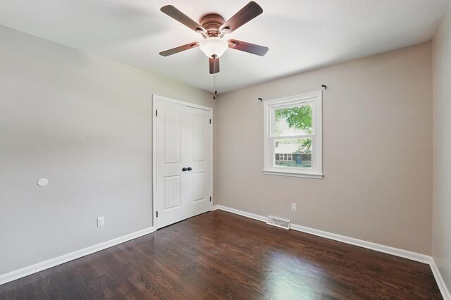 8020 Yecker Ave, Kansas City, KS 66109 - unfurnished room with baseboards, wood finished floors, and ceiling fan
