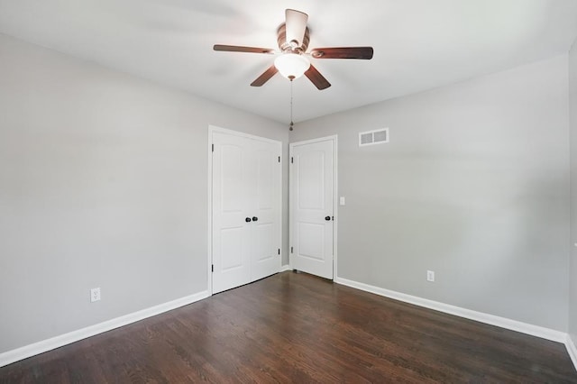 8020 Yecker Ave, Kansas City, KS 66109 - spare room featuring ceiling fan, baseboards, and dark wood-type flooring