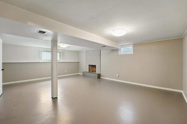 8020 Yecker Ave, Kansas City, KS 66109 - basement featuring a fireplace and baseboards