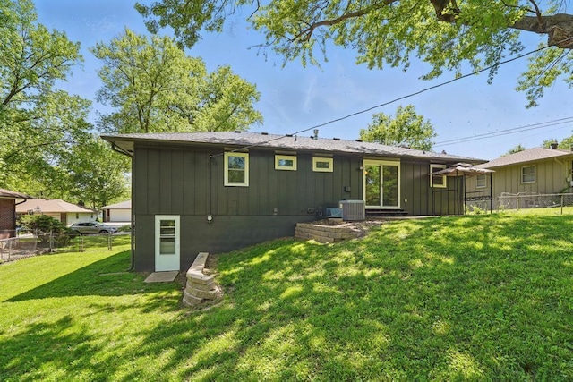 8020 Yecker Ave, Kansas City, KS 66109 - back of property featuring board and batten siding and cooling unit