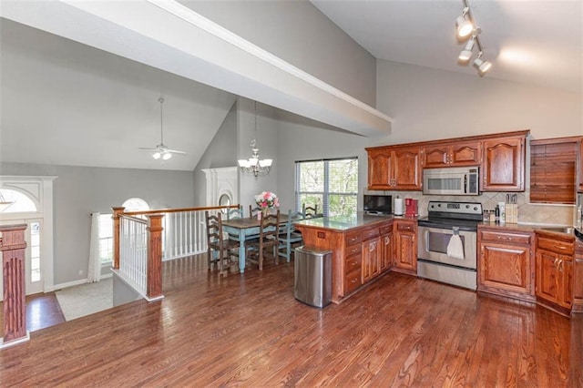 8115 NE 112th St, Kansas City, MO 64157 - kitchen with appliances with stainless steel finishes, a peninsula, high vaulted ceiling, brown cabinets, and tasteful backsplash