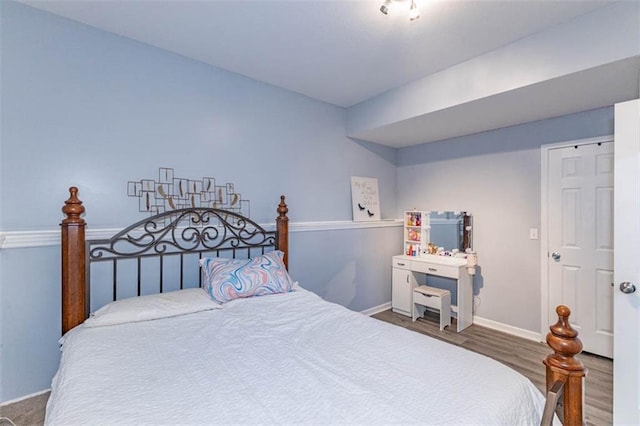 8115 NE 112th St, Kansas City, MO 64157 - bedroom featuring wood finished floors and baseboards