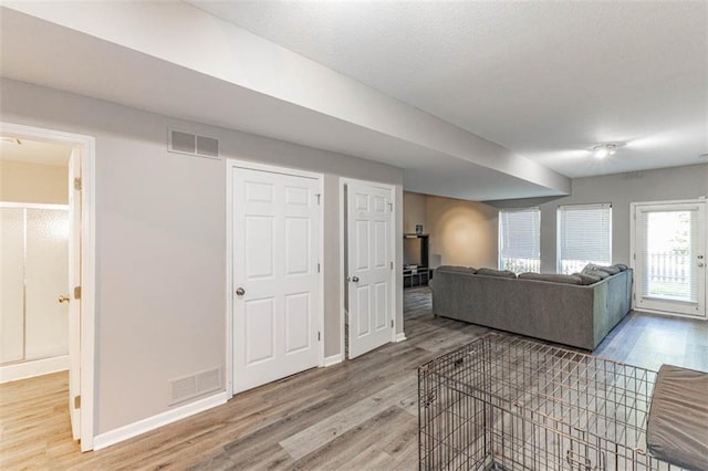 8115 NE 112th St, Kansas City, MO 64157 - living area featuring light wood-style floors and baseboards
