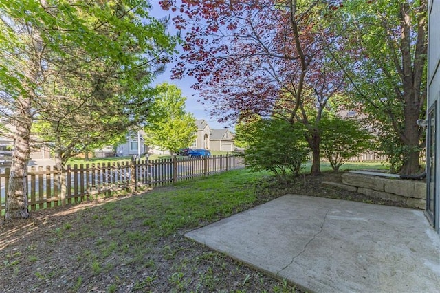 8115 NE 112th St, Kansas City, MO 64157 - fenced yard featuring a patio and a residential view
