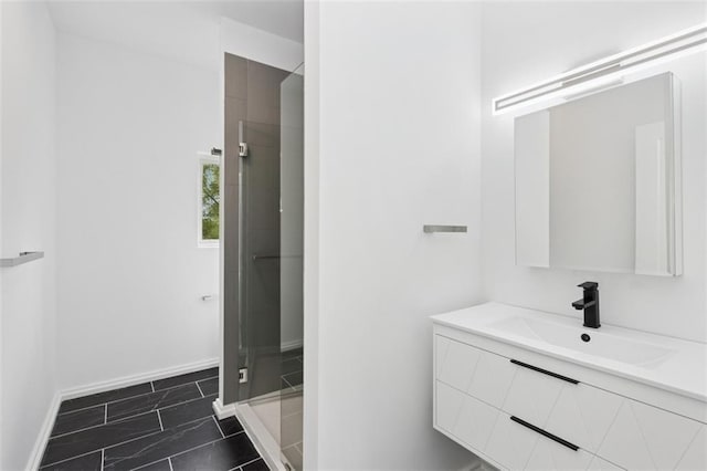 10924 W 67th St, Shawnee, KS 66203 - full bath with a stall shower, vanity, marble look tiles, and baseboards