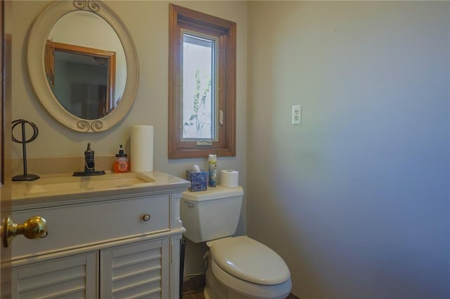 bathroom with toilet and vanity