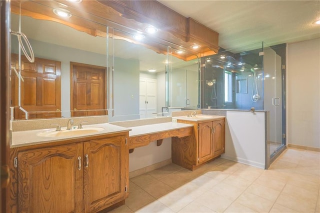 full bathroom featuring tile patterned flooring, a stall shower, two vanities, baseboards, and recessed lighting