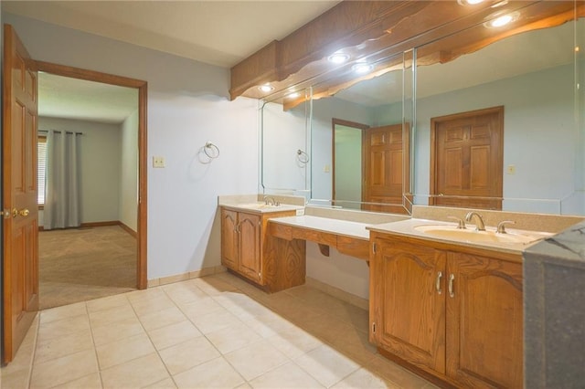 full bathroom with tile patterned floors, vanity, and baseboards
