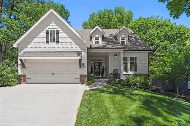 2704 W 74th St, Prairie Village, KS 66208 - view of front of home with brick siding, a front lawn, driveway, and roof with shingles