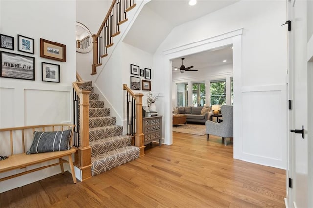 2704 W 74th St, Prairie Village, KS 66208 - stairs with wood finished floors, ceiling fan, recessed lighting, and lofted ceiling