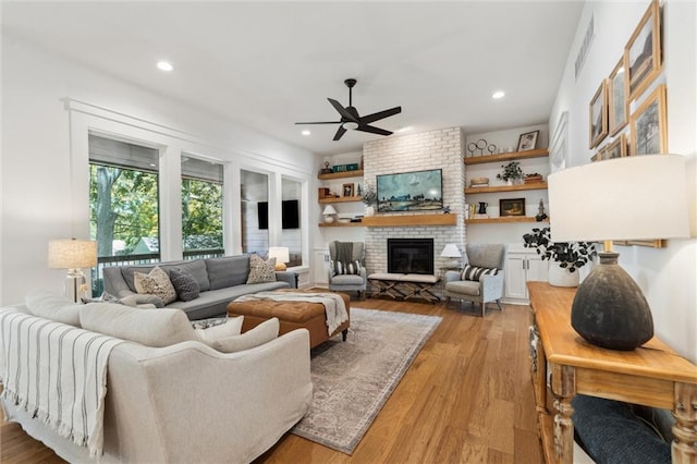 2704 W 74th St, Prairie Village, KS 66208 - living room with a ceiling fan, a fireplace, light wood-style flooring, and recessed lighting
