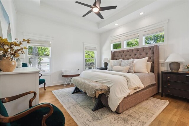 2704 W 74th St, Prairie Village, KS 66208 - bedroom with a tray ceiling, light wood-style floors, recessed lighting, and a ceiling fan