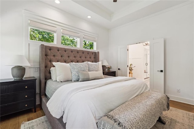 2704 W 74th St, Prairie Village, KS 66208 - bedroom with wood finished floors, recessed lighting, baseboards, crown molding, and connected bathroom