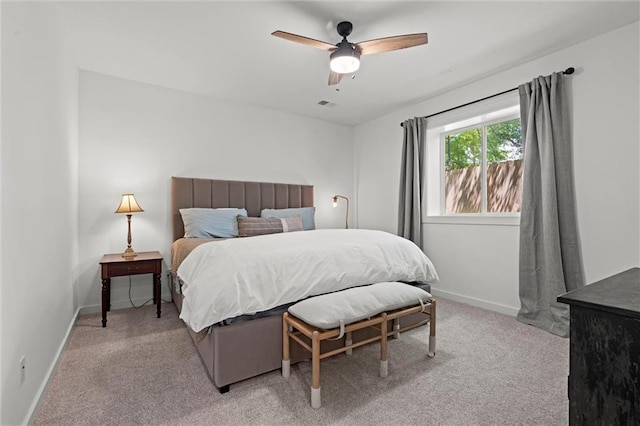 2704 W 74th St, Prairie Village, KS 66208 - bedroom with light colored carpet, baseboards, and a ceiling fan