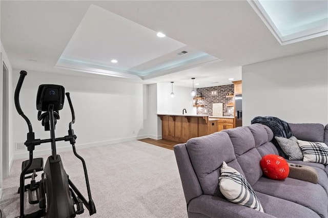 2704 W 74th St, Prairie Village, KS 66208 - living room featuring a raised ceiling, light carpet, baseboards, and recessed lighting