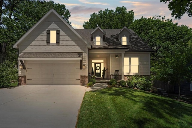 2704 W 74th St, Prairie Village, KS 66208 - view of front of house with brick siding, a front yard, driveway, and a porch