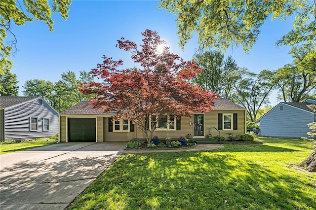 view of property hidden behind natural elements with an attached garage, a front lawn, and driveway