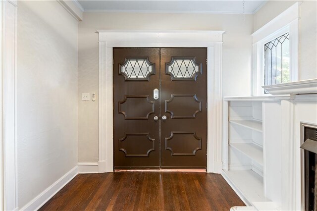 2803 Harrison St, Kansas City, MO 64109 - entrance foyer with wood finished floors, ornamental molding, and baseboards