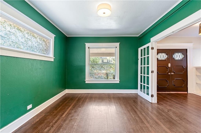 2803 Harrison St, Kansas City, MO 64109 - unfurnished room featuring wood finished floors, french doors, plenty of natural light, and ornamental molding