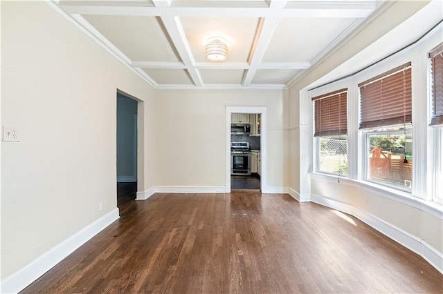 2803 Harrison St, Kansas City, MO 64109 - spare room featuring dark wood-style floors, coffered ceiling, baseboards, and beamed ceiling
