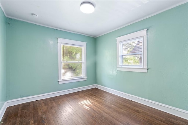 2803 Harrison St, Kansas City, MO 64109 - empty room featuring hardwood / wood-style floors, baseboards, and ornamental molding