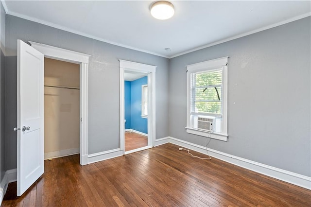 2803 Harrison St, Kansas City, MO 64109 - unfurnished bedroom featuring hardwood / wood-style floors, baseboards, crown molding, cooling unit, and a closet