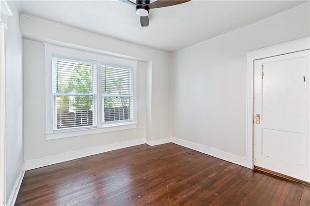 2803 Harrison St, Kansas City, MO 64109 - empty room with dark wood-style floors, a ceiling fan, baseboards, and ornamental molding