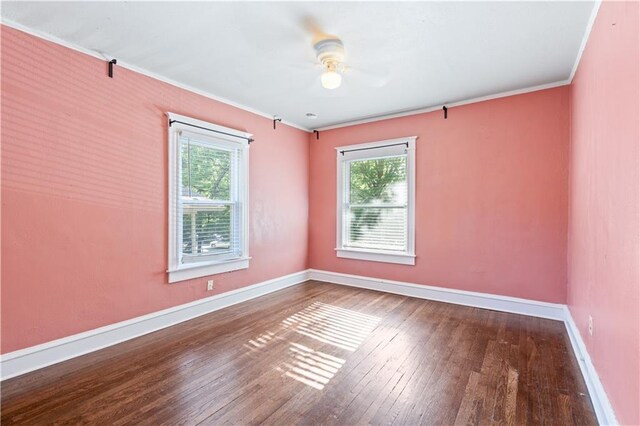 2803 Harrison St, Kansas City, MO 64109 - unfurnished room featuring plenty of natural light, a ceiling fan, baseboards, hardwood / wood-style floors, and crown molding