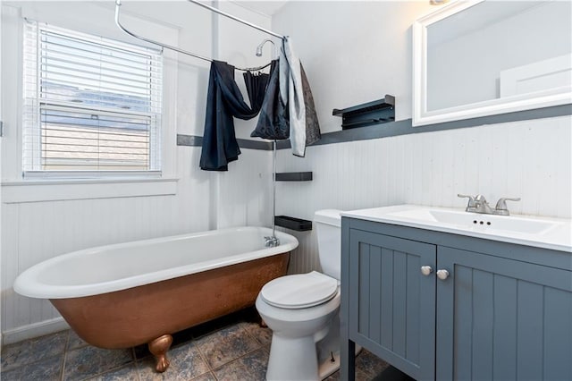 2803 Harrison St, Kansas City, MO 64109 - full bath featuring a wainscoted wall, a freestanding bath, toilet, and vanity