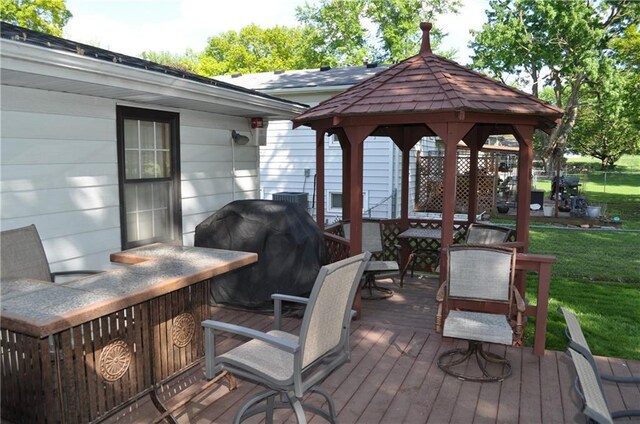 1514 Frankie Ln, Saint Joseph, MO 64503 - wooden deck with a yard, a grill, and a gazebo