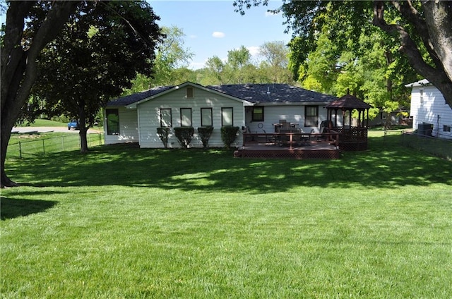 1514 Frankie Ln, Saint Joseph, MO 64503 - back of house with a yard, a gazebo, a deck, and a fenced backyard