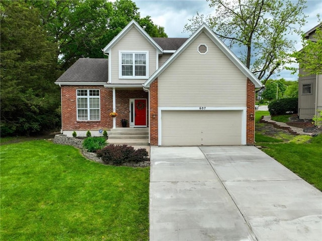 607 E 122nd St, Kansas City, MO 64145 - traditional home featuring driveway, a front yard, a garage, and brick siding
