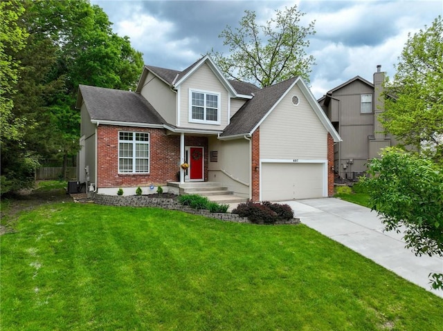 607 E 122nd St, Kansas City, MO 64145 - traditional-style home featuring brick siding, concrete driveway, a front yard, and cooling unit